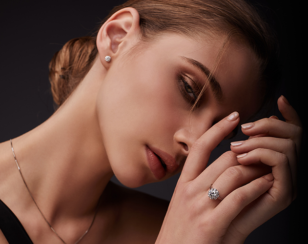 A model wearing the Estrella collection of ring, earrings, and necklace - D&P Malaysia